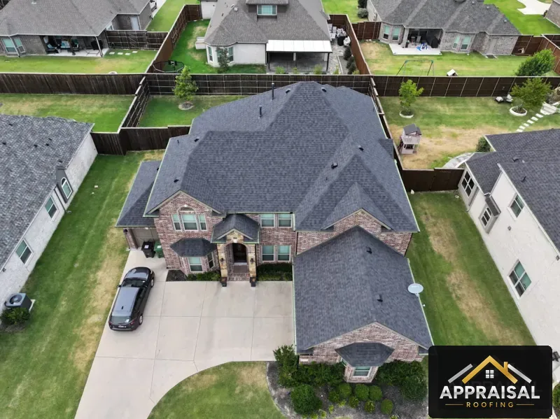 New shingle roof on a two story brick home, drone view